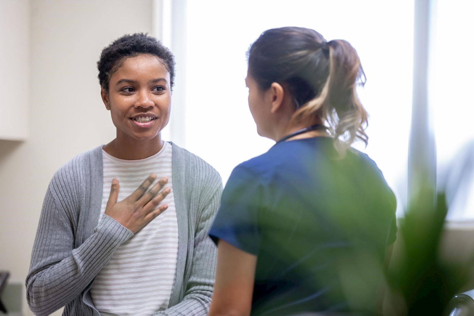 Woman speaks to female doctor