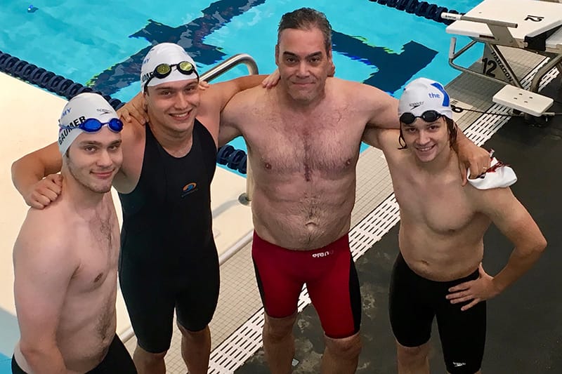 Photo of Craig Gaumer with kids swimming