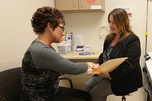 Patient looking at form with Provider