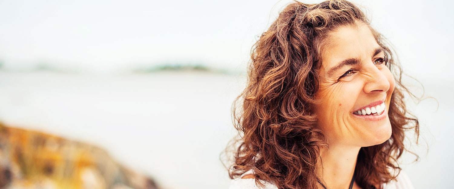 Woman smiling off in the distance. 