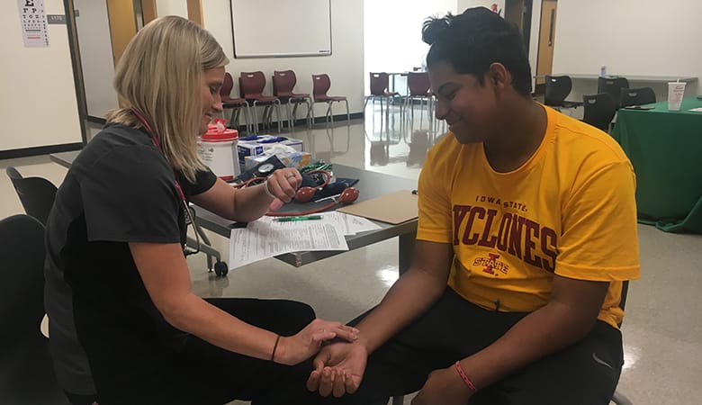 nurse checking heart rate